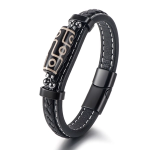 Handmade leather bracelet for men featuring a dZi bead totem and magnetic clasp