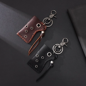 Vintage leather lighter case keychains in black and brown with rustic alloy spring hooks