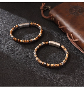Detail of vintage men's lapis stone beaded leather bracelet with magnetic metal clasp