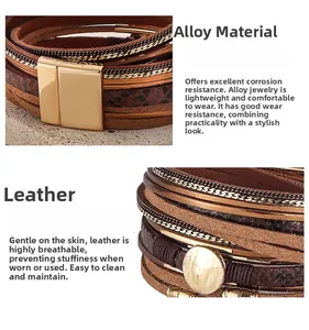 Detail of bohemian multilayer snake print leather bracelet with magnetic gold clasp