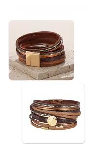 Close-up of multilayer snake print leather bracelet with gold magnetic clasp and metal chains