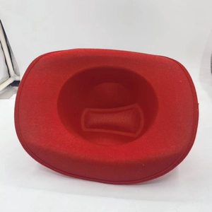 Top view detail of the interior and wide brim of a red felt party magician hat