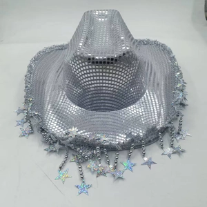 Detail of silver cowboy hat with disco sequins, bead tassels, and laser star pendants