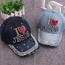 Detail of blue denim baseball caps with I Heart Jesus rhinestone slogans and sparkling studs