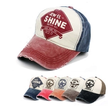 Detail of vintage washed baseball cap featuring distressed brim and SHINE MOTOR OIL print