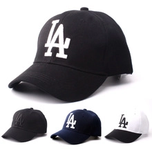 Detailed embroidery of the LA logo on cotton baseball caps in multiple colors