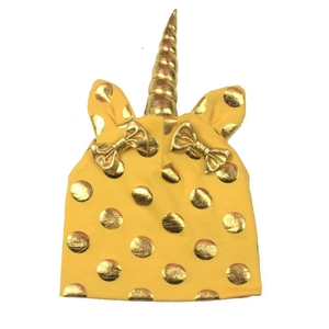 Yellow unicorn knit hat for babies with golden horn, ears, and metallic polka dots