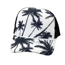 Detail of white truck hat brim with black palm tree prints and white accent rope