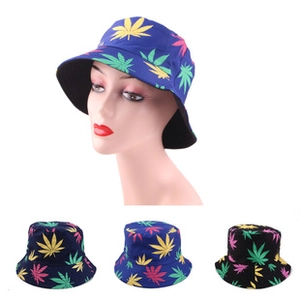 Detail of double-sided bucket hats featuring all-over cannabis leaf print on cotton fabric
