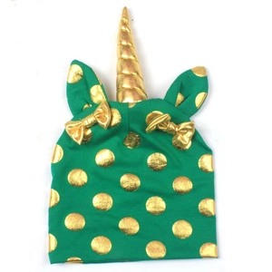 Green knit toddler hat with gold polka dots, unicorn horn and dual bows for kids