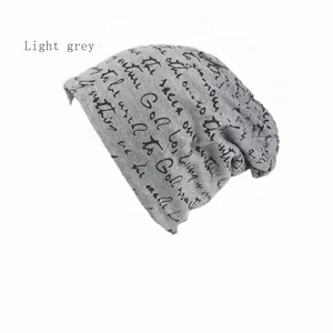 Light grey slouchy beanie with black handwritten typography print for casual street style