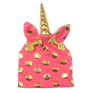 Pink knit baby hat with unicorn horn, golden polka dots and bow tie decorations