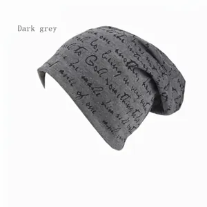 Dark grey knitted slouchy beanie with black cursive lettering for a street style look