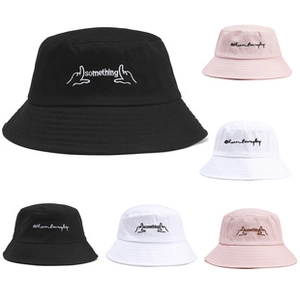 Close-up of premium cotton canvas bucket hat featuring fine letter and graphic embroidery