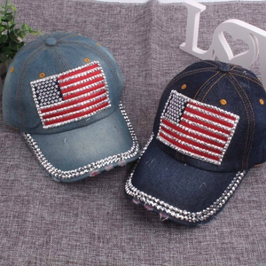 Detail of light and dark blue denim baseball caps with rhinestone American flag patterns