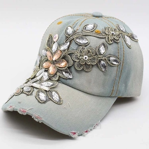 Women's light blue denim baseball cap with floral embroidery and rhinestone detailing