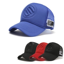 Close-up of breathable mesh trucker caps with logo detail and stage crew woven label