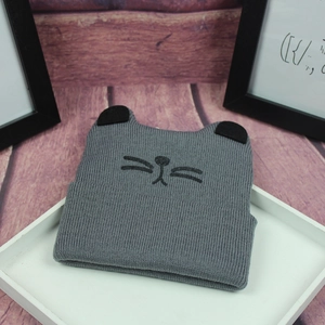 Winter knitted cat ear hat for children in grey with cute embroidered whiskers
