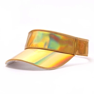 Detail of holographic gold sun visor hat showing iridescent finish and fine stitching