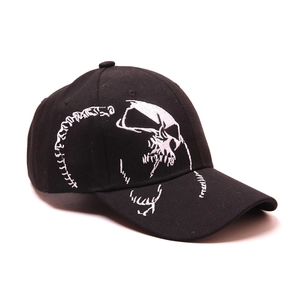 Close-up of a black cotton baseball cap with white skull spine embroidery detail