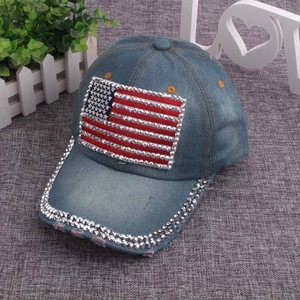 Detail of washed denim baseball cap with rhinestone American flag and studded brim trim