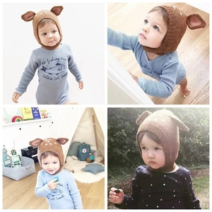 Detail shots of baby deer earflap hat in brown knit with white polka dots and cute 3D antlers
