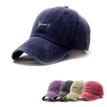 Detail showing five colors of washed cotton baseball caps with Yours embroidery