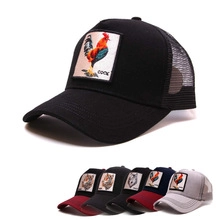 Detail of black trucker hat with colorful rooster embroidery patch and breathable mesh