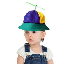 Close-up of kids propeller bucket hat with colorful patchwork design and top bead detail