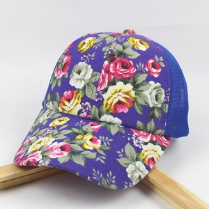 Detailed view of purple floral baseball cap with breathable blue mesh and rose prints