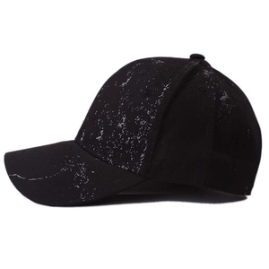 Detailed side view of black baseball cap with grey splatter embroidery and six-panel design