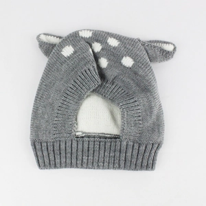Close-up of gray knit deer hat with 3D ears and white polka dots for babies