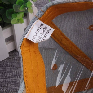 Detail view of the 100% cotton inner lining and washing label of the denim baseball cap