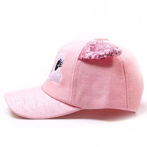 Detailed side view of pink kids baseball cap featuring sequin cat ears and eye embroidery