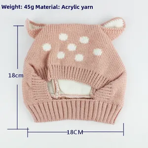 Detail of pink knitted baby deer hat showing acrylic yarn texture and 45g weight