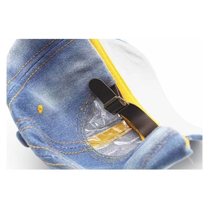 Rear view of a blue denim baseball cap showing leather strap and metal adjustment buckle