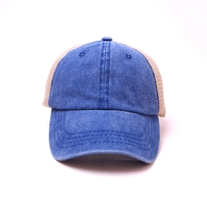 Detailed view of denim blue baseball cap with breathable beige mesh and neat stitching