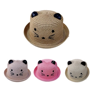 Detail of four children's straw hats with 3D cat ears and embroidered animal faces