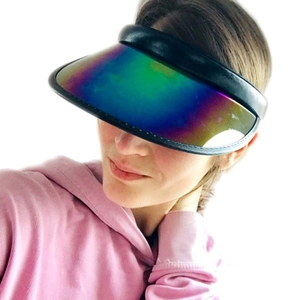 Detail of gradient rainbow PVC sun visor with black faux leather trim for sun protection