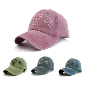 Distressed vintage baseball caps in four colors featuring Route 66 shield embroidery