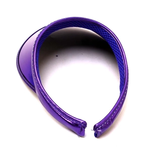 Detail view of purple PVC sun visor with metallic finish and breathable blue mesh lining