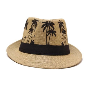 Detailed texture of straw fedora hat featuring black palm tree silhouettes and band