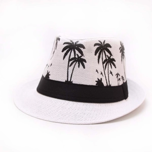 White Panama straw hat with black palm tree patterns and decorative band for sun protection
