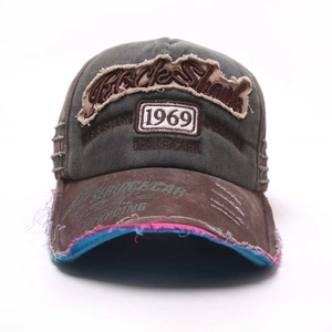 Detail of vintage 1969 baseball cap featuring distressed edges and Black Shark embroidery