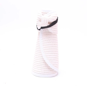 Detail of rollable straw sun visor featuring white woven texture and black elastic strap