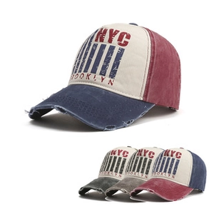 Close-up of vintage distressed NYC Brooklyn baseball cap with patchwork design and torn brim