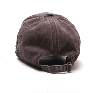 Detail of adjustable metal buckle and vintage distressed frayed hem on baseball cap