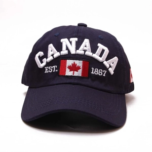 Detailed close-up of navy blue cotton baseball cap with white 3D Canada embroidery
