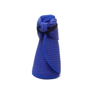 Detail of rollable blue woven sun visor with bow and elastic band for easy storage