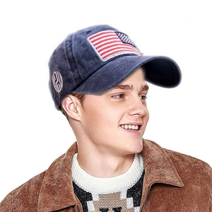 Navy blue washed vintage baseball cap with American flag patch and side logo shown on model